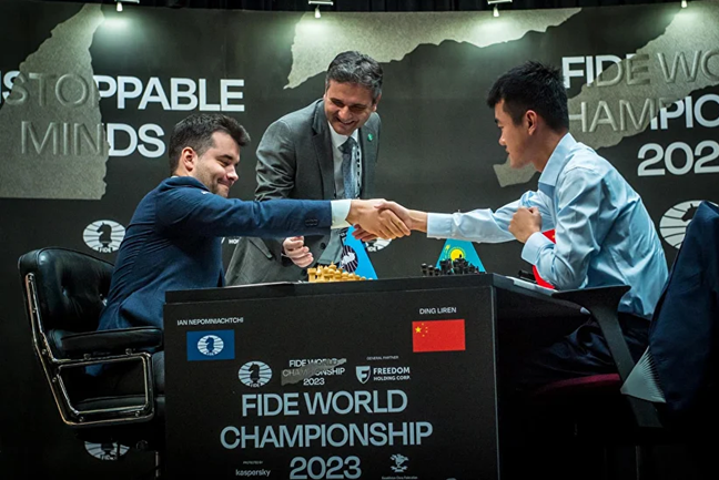 Photo: FIDE / Anna Shtourman - Handshake before Game 3 World Chess Championship